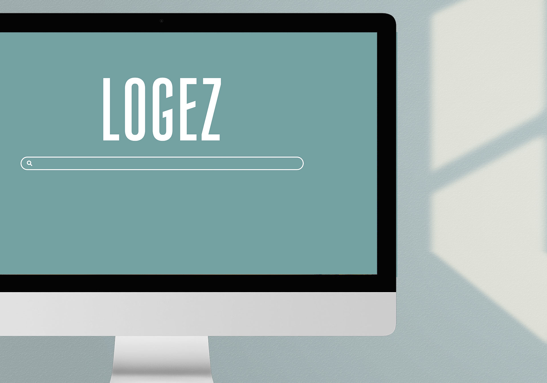 iMac mit Suchfeld und Logez Logo, SEO